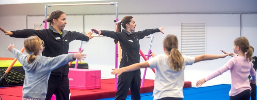 Gymnastics coaches training children at Aquahub