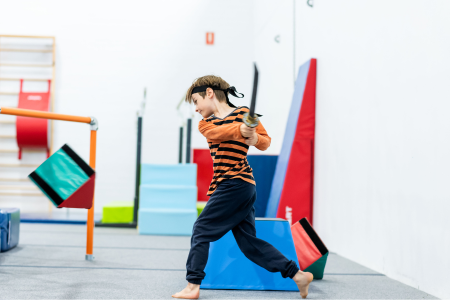 Ninja participant knocking over blocks