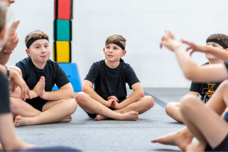 Ninja class being guided through meditating